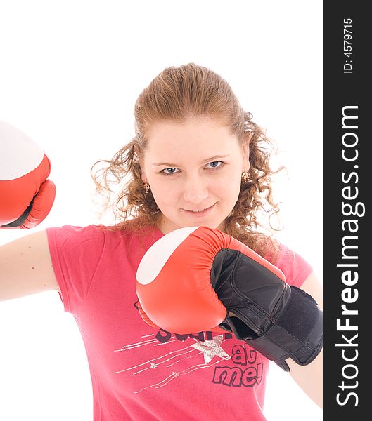 The young beautiful girl with boxing gloves isolated on a white background. The young beautiful girl with boxing gloves isolated on a white background