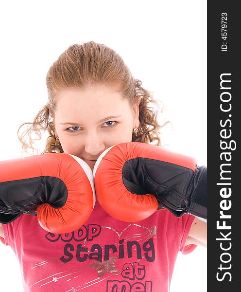 The young beautiful girl with boxing gloves isolated on a white background. The young beautiful girl with boxing gloves isolated on a white background