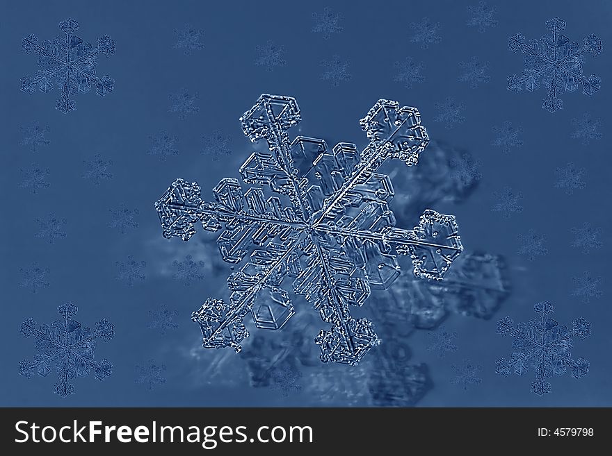 Small snowflake on blue background. Small snowflake on blue background