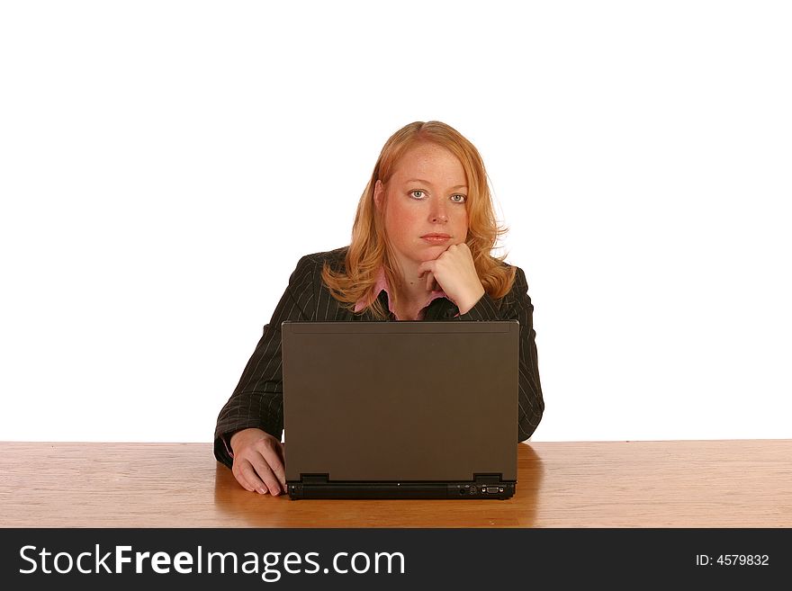 Isolated business woman working on laptop