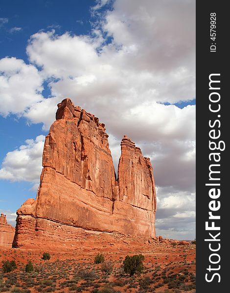View of the red rock formations in Arches National Park with blue sky�s and clouds. View of the red rock formations in Arches National Park with blue sky�s and clouds