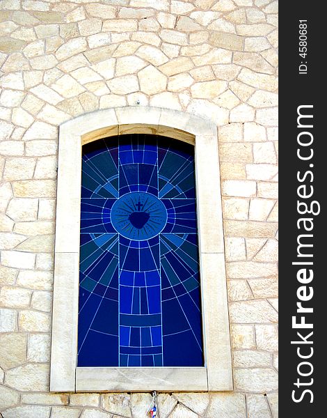 Photo of a stained glass church window taken in Chinorlet, Costa Blanca, Spain. Photo of a stained glass church window taken in Chinorlet, Costa Blanca, Spain