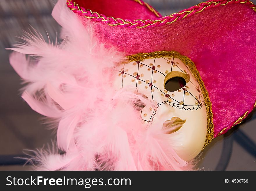 Carnival mask with rich purple and pink colors