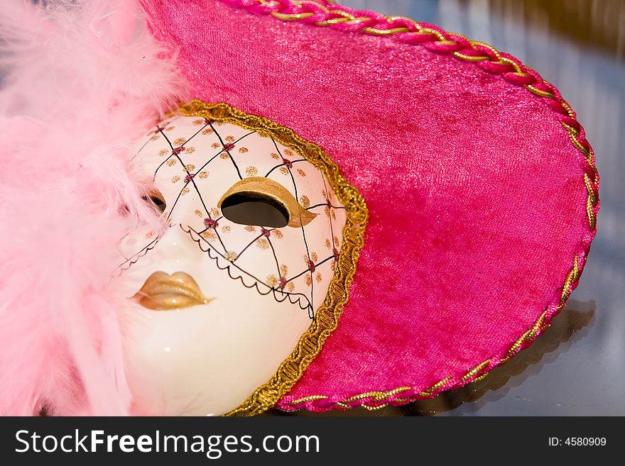 Carnival mask with rich purple and pink colors