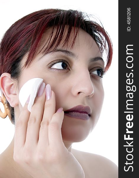 Cleaning face with cotton cosmetic pad