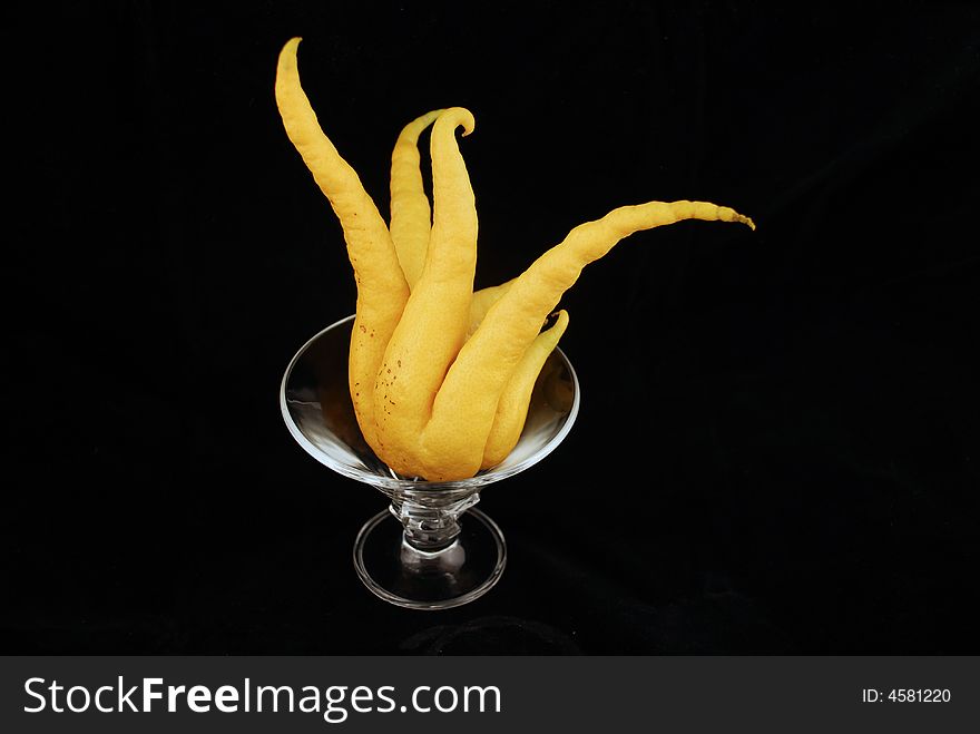 Strange organic lemon isolated by black background