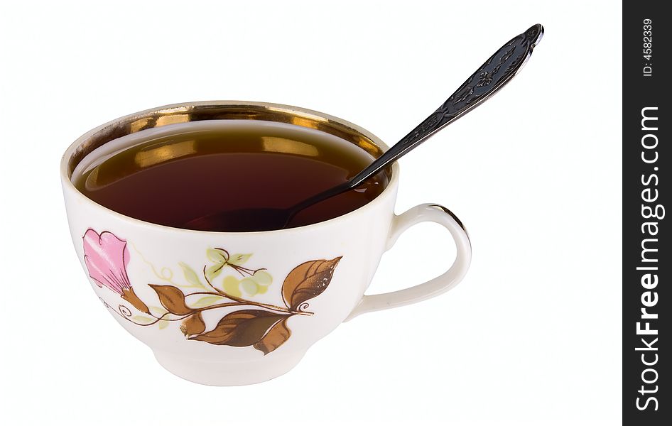 Tea cup, with tea and spoon. Isolated on white, clipping path included.