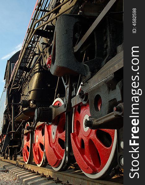 Wheels of a steam locomotive close up