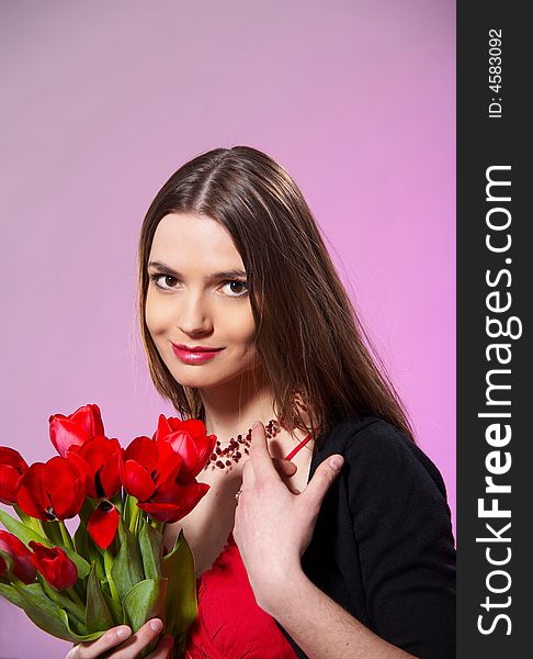 Portrait of  young woman with flowers