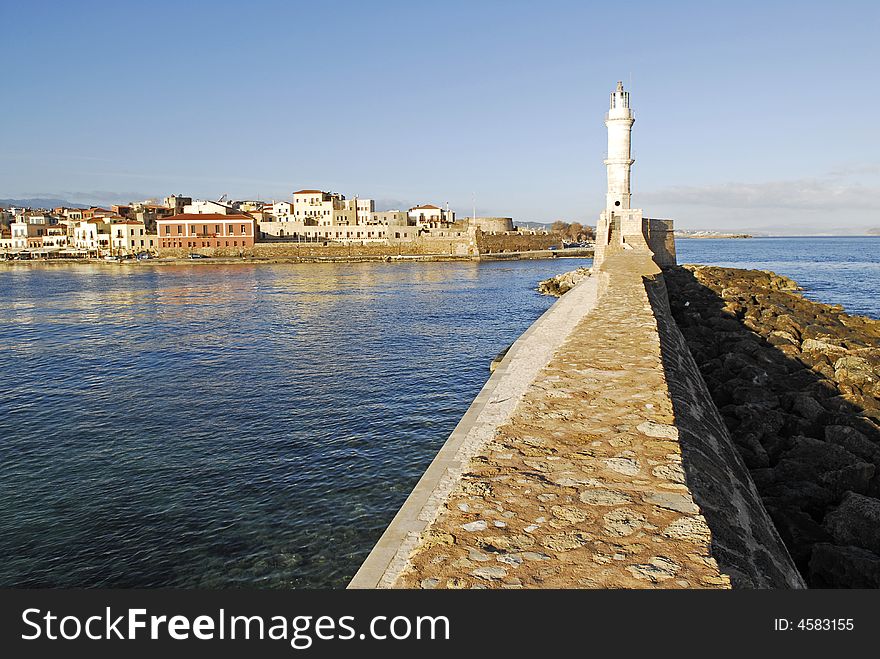 Light Tower In The Harbour Of Chania