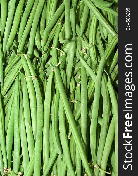 Green beans piled high for sale in asian food shop