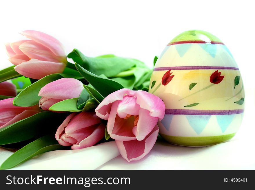 Colorful Easter eggs, tulips, bucket