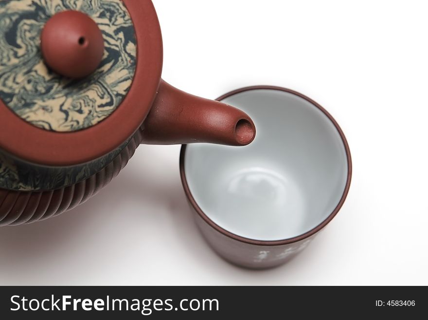 Traditional japan teapot with a cup