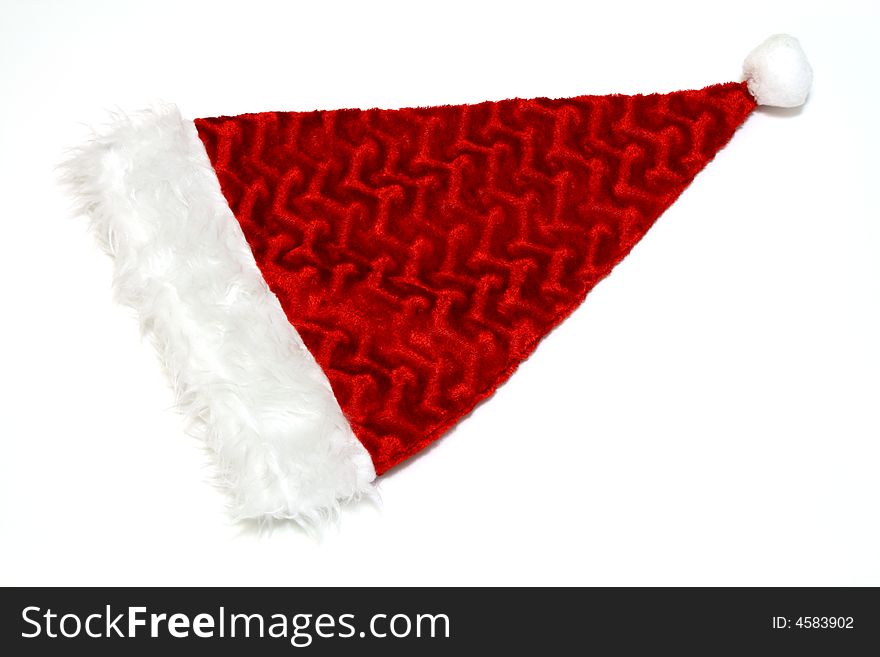 Santa claus hat on a white surface. Santa claus hat on a white surface