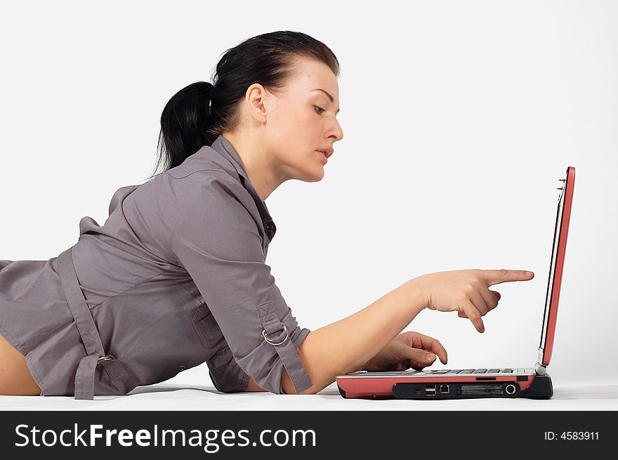 Attractive brunette woman with laptop on white background. Attractive brunette woman with laptop on white background