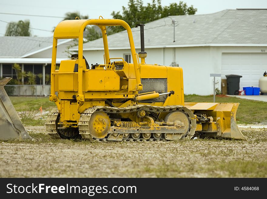 A small bulldozer at rest over the weekend