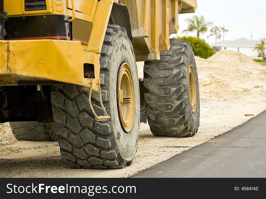 The rolling end of a dump truck: Tires and wheels