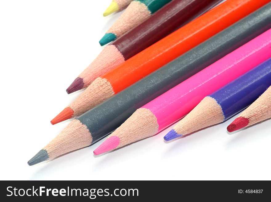 Colored pencils on white background. Colored pencils on white background.
