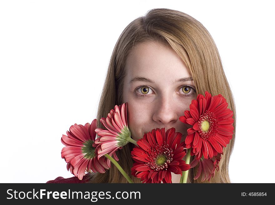 Teenage girl with braces holding daisies and looking at camera. Teenage girl with braces holding daisies and looking at camera.
