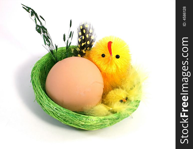 Egg and Chickens in the nest as the symbol of Easter. Egg and Chickens in the nest as the symbol of Easter