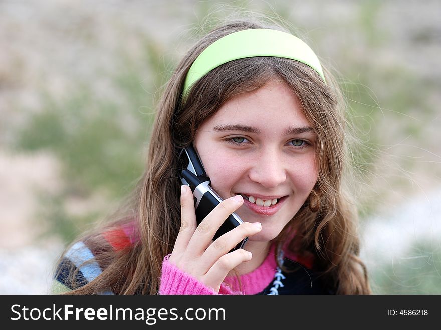 Young and happy girl and cell phone. Young and happy girl and cell phone