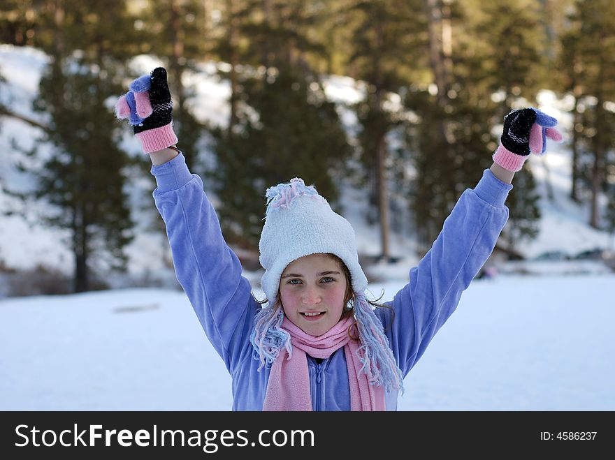 Young girl is playing in the snow. Young girl is playing in the snow