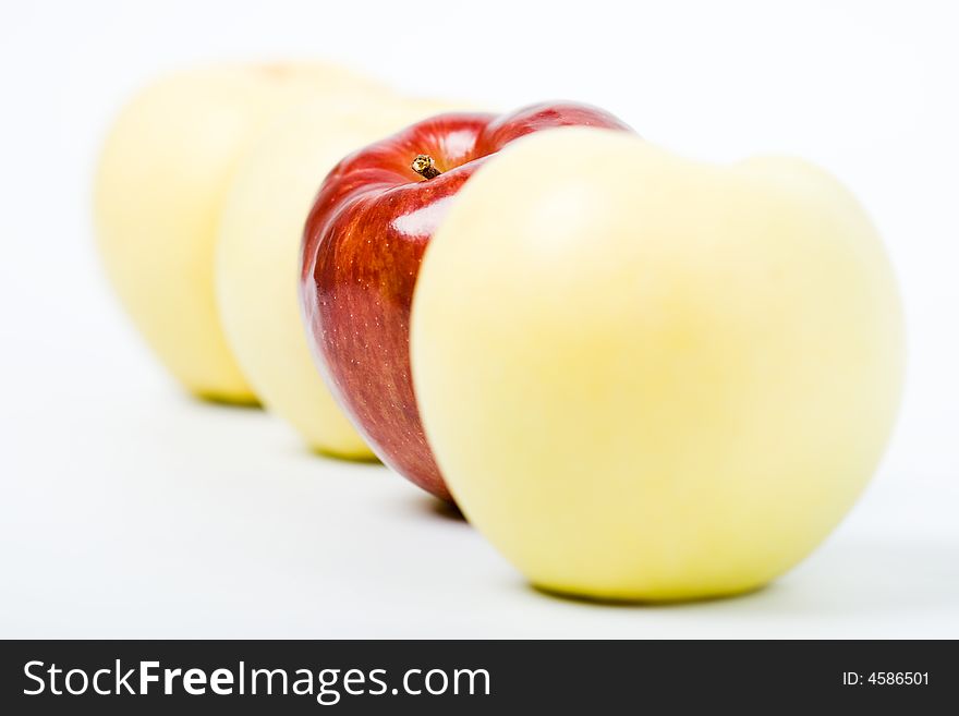 Three yellow and one red apples. Three yellow and one red apples