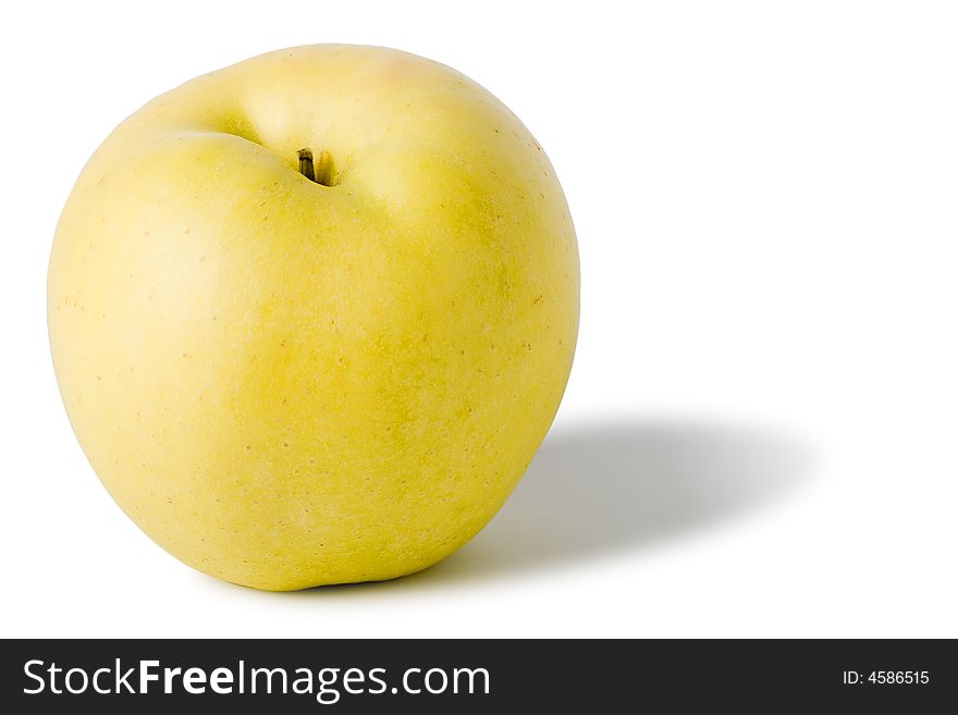 One yellow apple with shadow isolated on white background