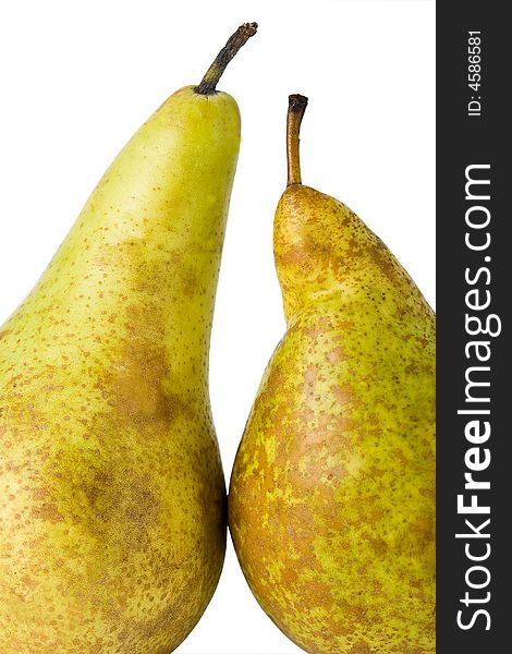 Two green closeup pears on the white background. Two green closeup pears on the white background