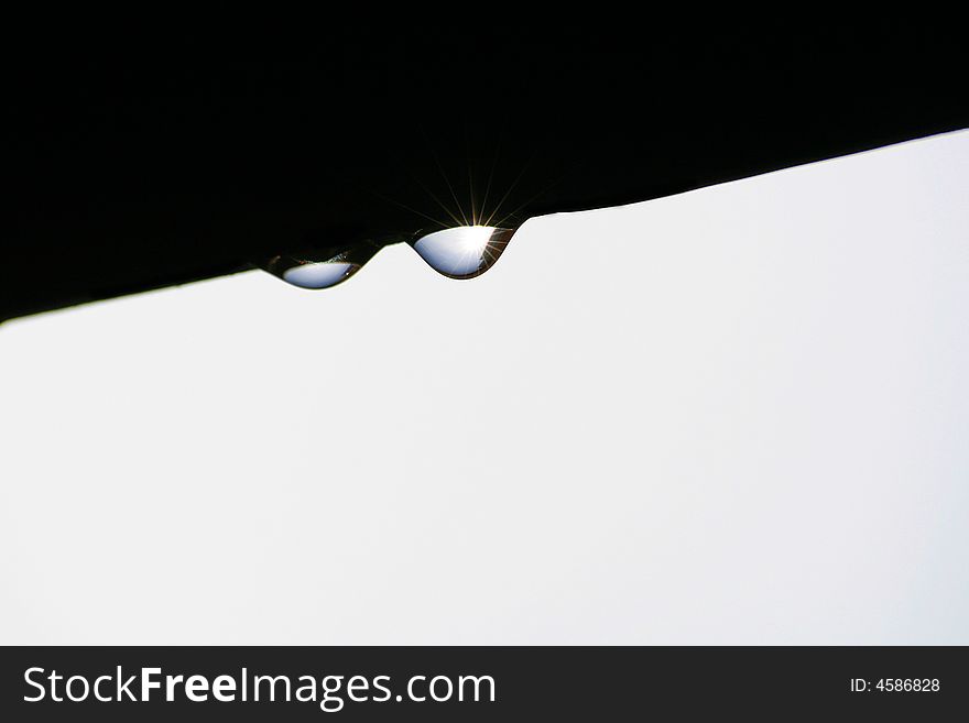 Water droplet hanging from above, abstract. Water droplet hanging from above, abstract