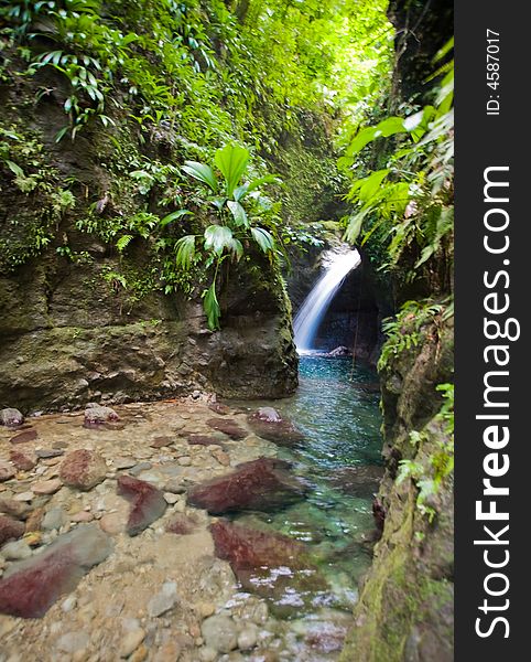 Spectacular waterfall and pool on lush tropical island. Spectacular waterfall and pool on lush tropical island