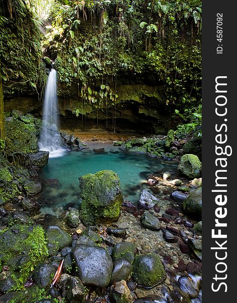 Spectacular waterfall and pool on lush tropical island. Spectacular waterfall and pool on lush tropical island