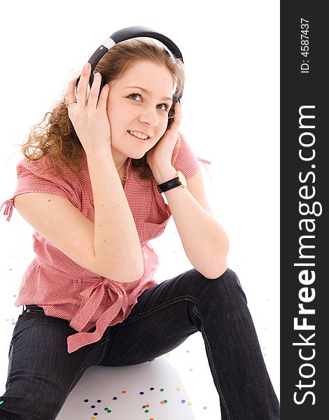 The young girl with a headphones isolated on a white background