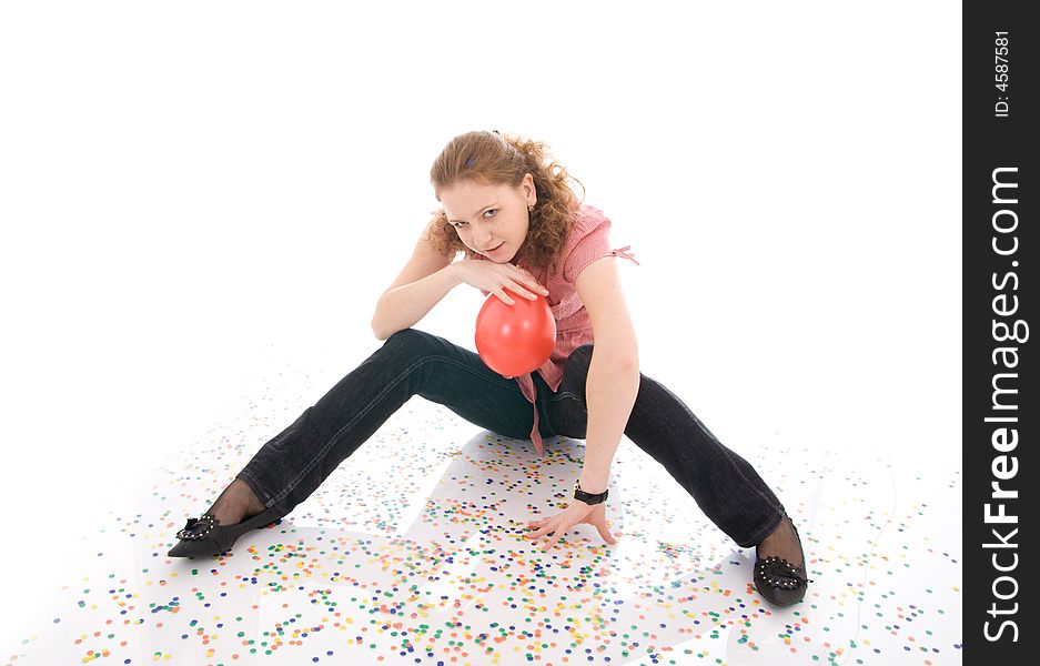The young beautiful girl with the confetti isolated on a white background. The young beautiful girl with the confetti isolated on a white background