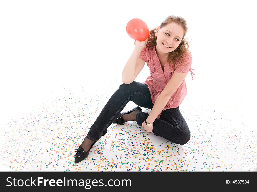 The young beautiful girl with the confetti isolated on a white background. The young beautiful girl with the confetti isolated on a white background