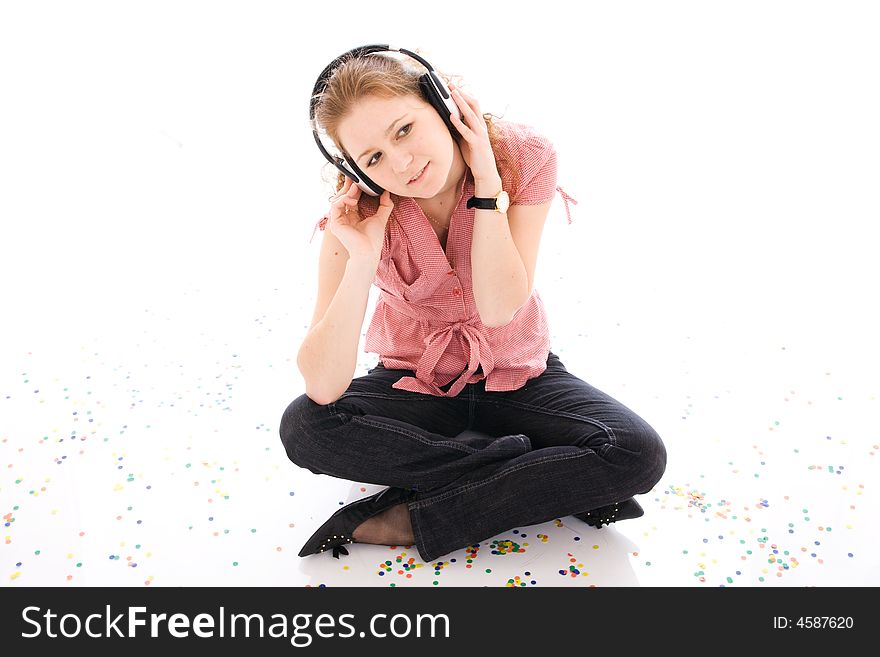 The young girl with a headphones isolated on a white background. The young girl with a headphones isolated on a white background