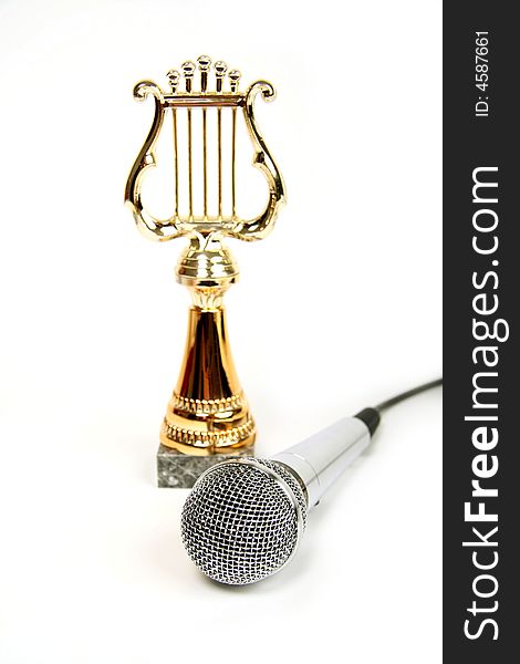 Microphone with a black cord on white background. Microphone with a black cord on white background.