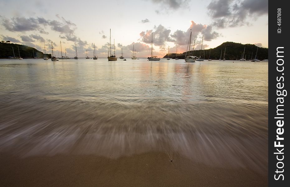 Sunset light over anchored boats on tropical island of Antigua. Sunset light over anchored boats on tropical island of Antigua