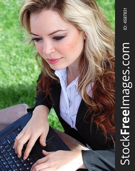 Portrait of a confident and successful businesswoman with a laptop. Portrait of a confident and successful businesswoman with a laptop