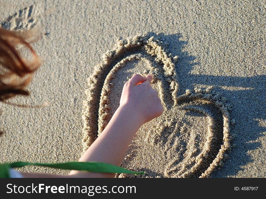 Heart figure drawn on the beach depicting love. Heart figure drawn on the beach depicting love