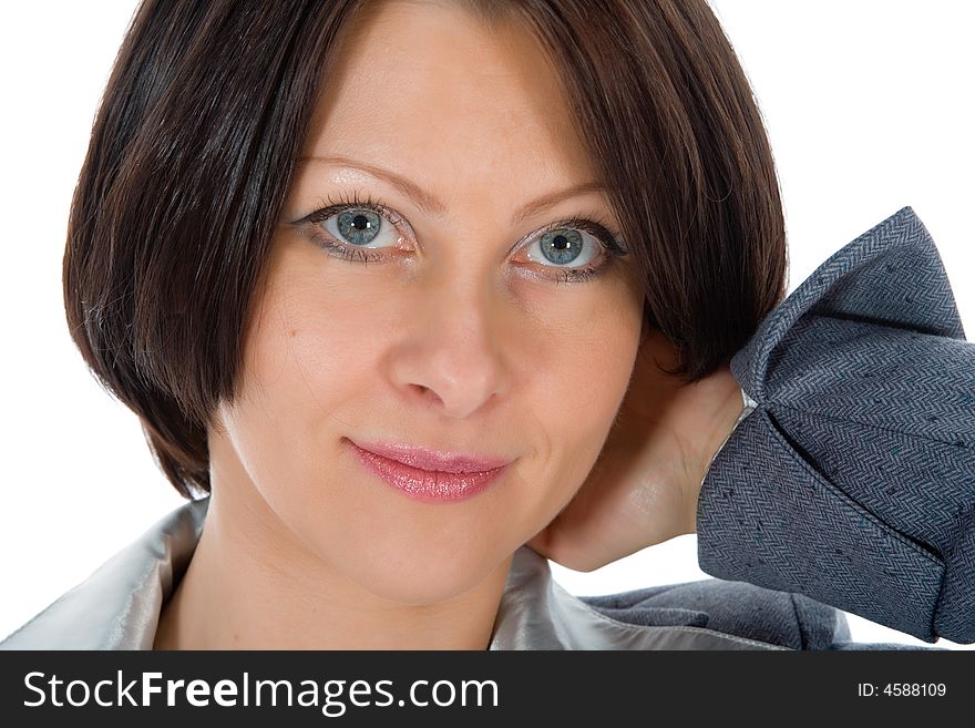 Portrait of the brunette with blue eye on  white background