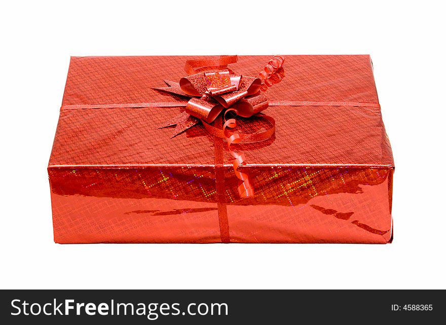 Red celebratory gift box isolated on white