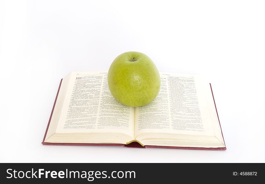 Green apple and stack of book. Green apple and stack of book