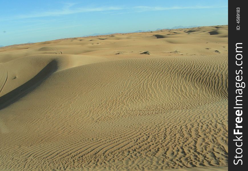 A panoramic view of sand in the desert