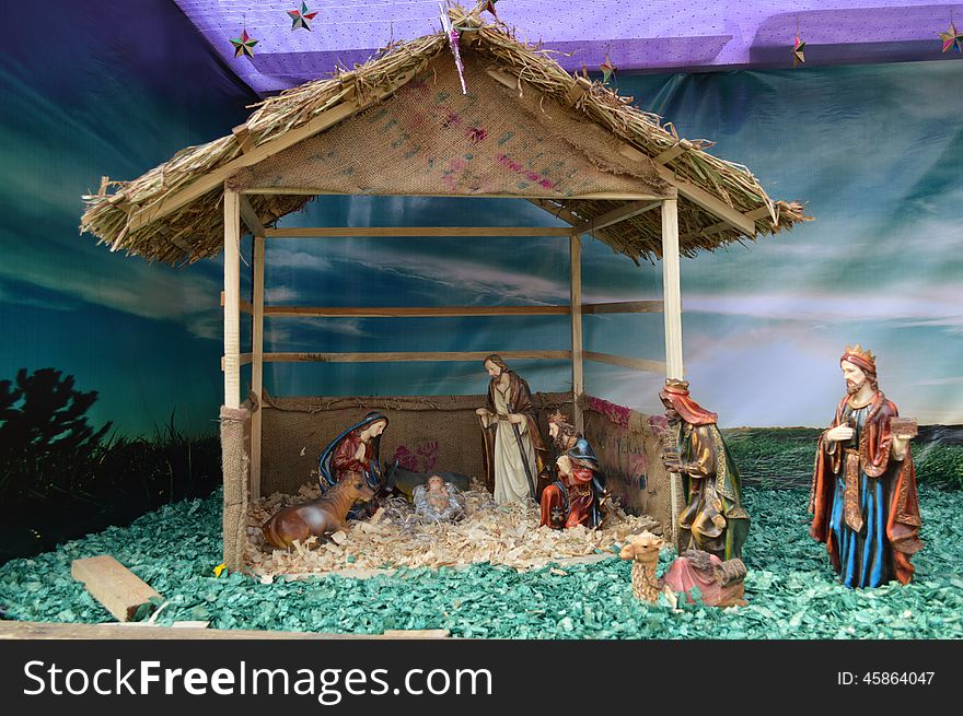 There is small hut having beautiful decoration of birth of Jesus Christ. I have clicked this picture during Christmas festival, 2013 at Ahmedabad. Decoration having camels, goats, starts, mother merry, moon, grass, angels and well wishers. There is small hut having beautiful decoration of birth of Jesus Christ. I have clicked this picture during Christmas festival, 2013 at Ahmedabad. Decoration having camels, goats, starts, mother merry, moon, grass, angels and well wishers.