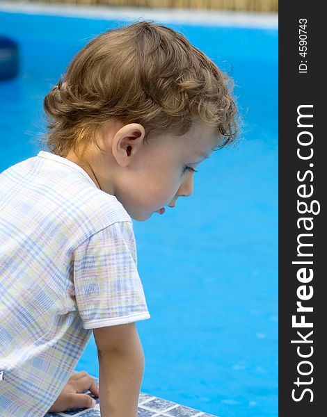 Curly boy at a pool (05)