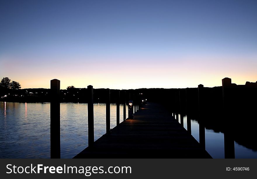 Wooden boat docking platforms in the evening sun light