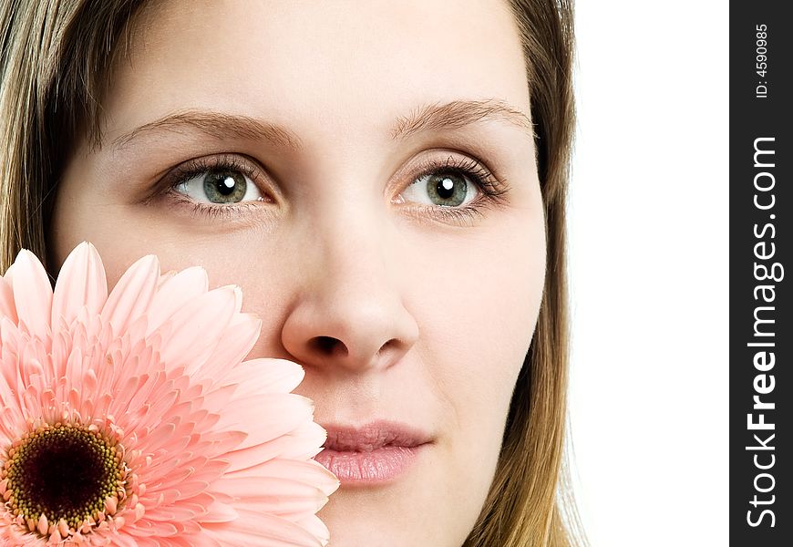 Close up portrait of a girl with pink flower. Close up portrait of a girl with pink flower