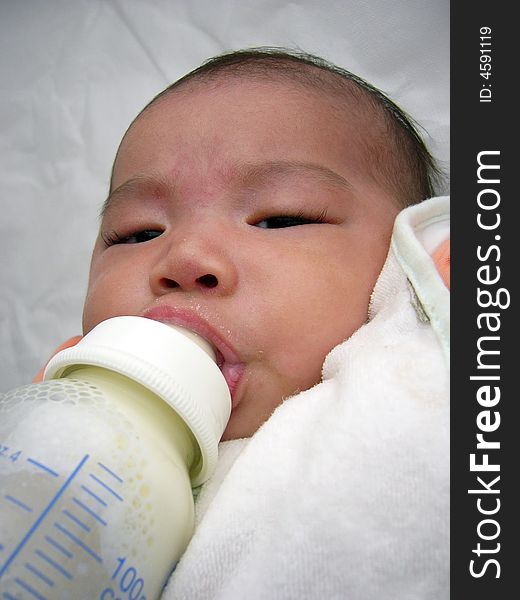 Asian Baby Milk Feeding With Head Leaning