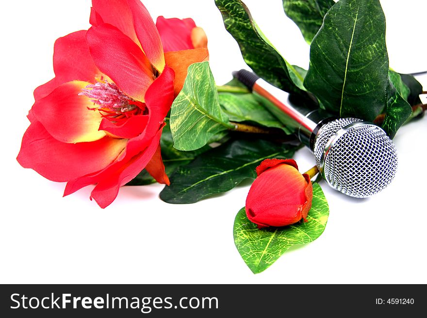 Microphone with red flower on white background. Microphone with red flower on white background.
